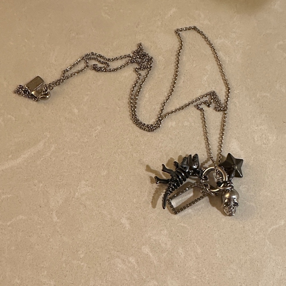 Coach Rexy skull star 4 charm necklace
